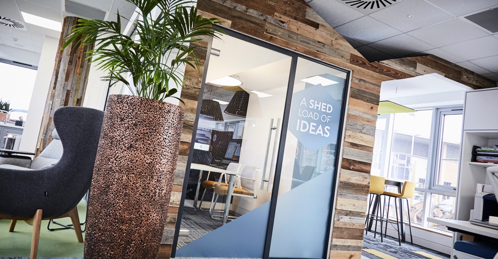 Modern meeting room with table, chairs, and presentation screen