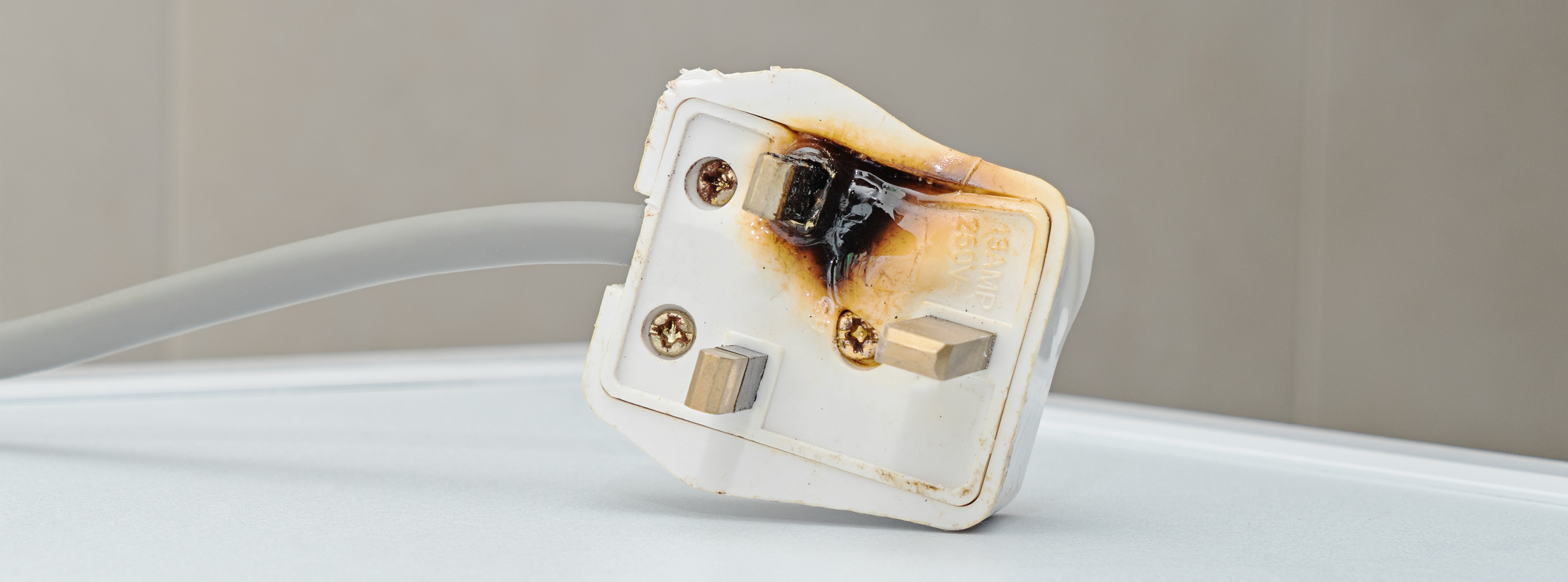 Charred UK plug socket